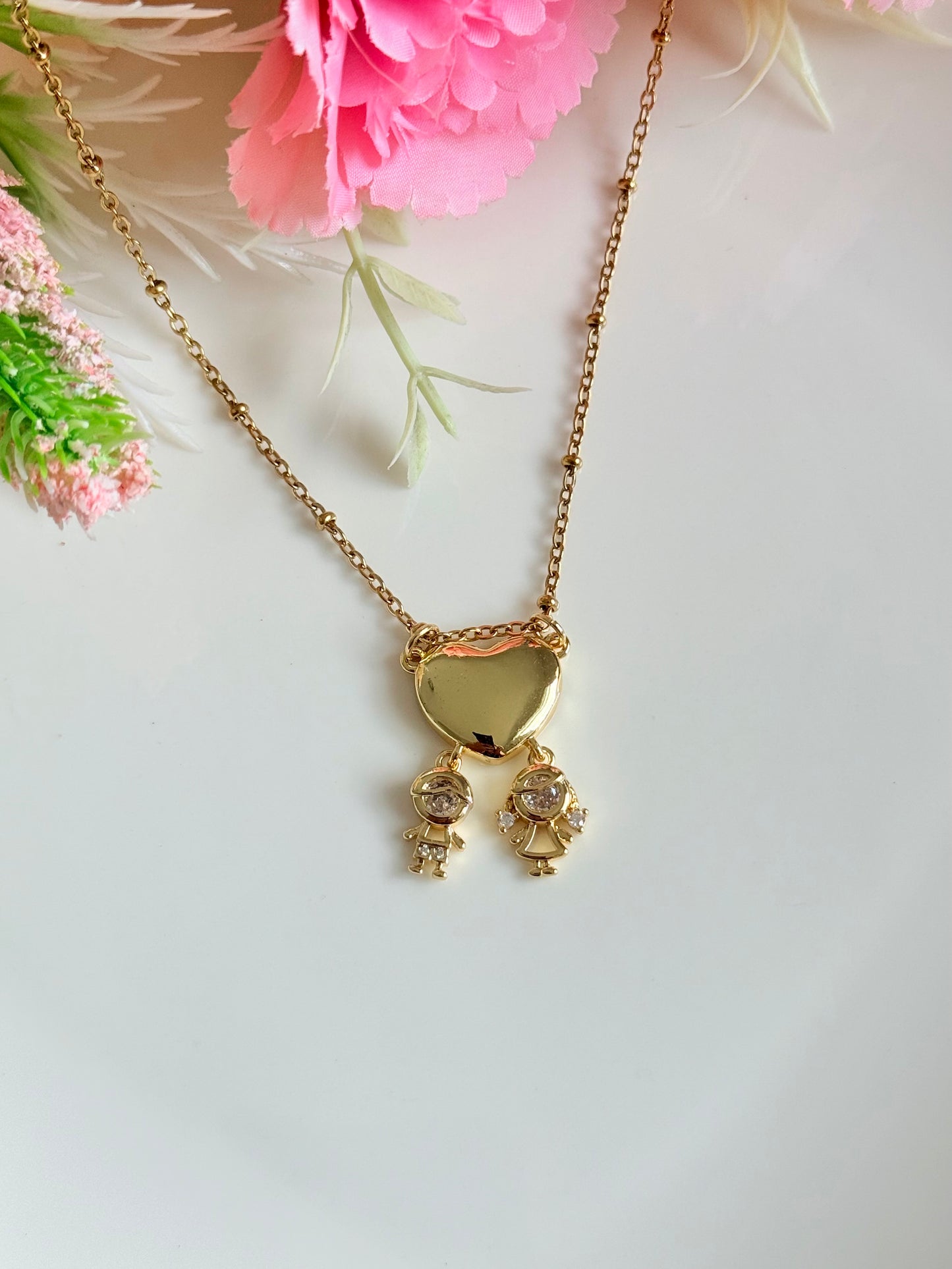 Cadena colgante niño y niña